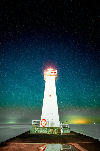 The View of Starry Night Over The Woods and Lighthouse in Lake Ontario