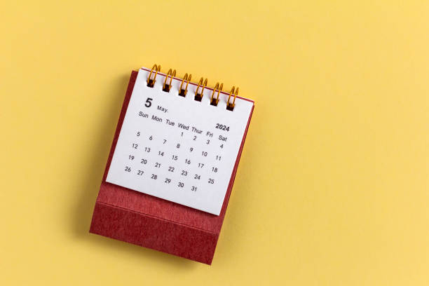 istock Desktop calendar for May 2024 on a yellow background. 2148664530