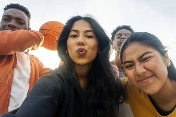 istock Friends grimacing taking a selfie while playing outdoor basketball 2148665051