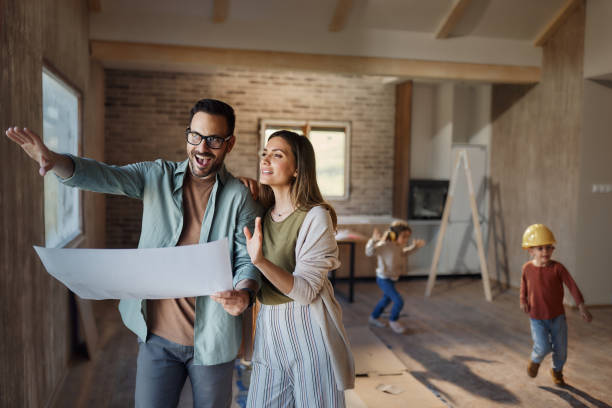 Happy parents making plans in their new home.