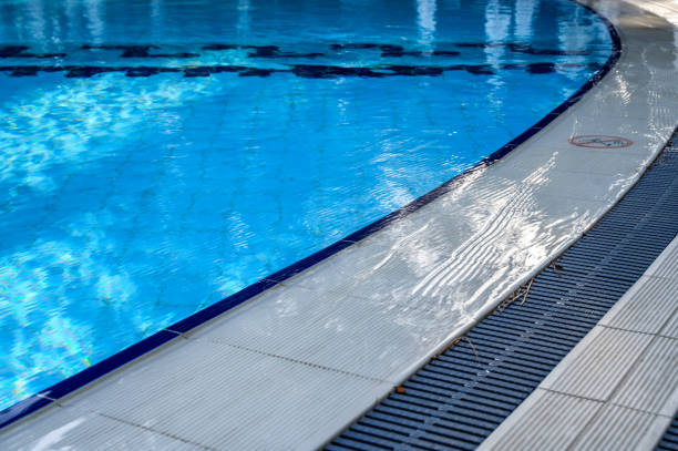 istock Pool edge of a large swimming pool with clean water 2148665998
