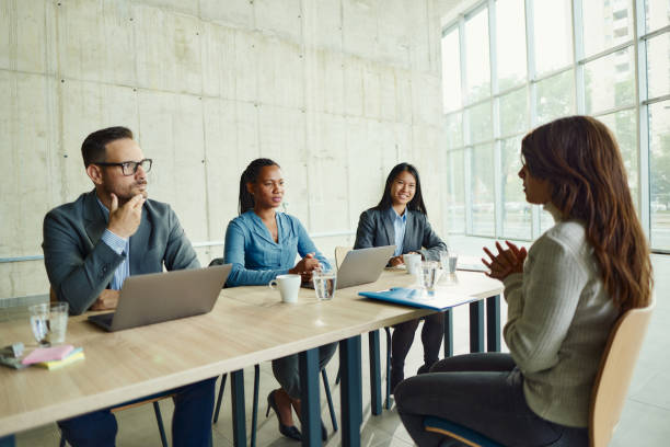 istock Mixed race human resource team talking to a candidate on a job interview. 2148666657