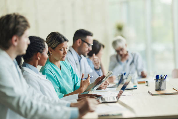 istock Female doctors using touchpad on a meeting in hospital. 2148666870