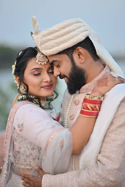 istock Bride & Groom embracing and holding each other 2148667034
