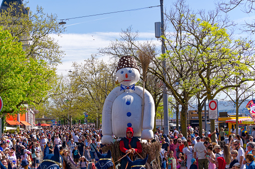 Annual traditional spring festival named Sechseläuten with guest canton Appenzell Ausserrhoden and snowman on horse carriage at Swiss City of Zürich on a sunny day. Photo taken April 14th, 2024, Zurich, Switzerland.