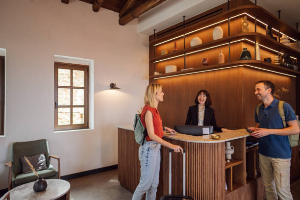istock Tourist couple checking into a hotel 2148669994
