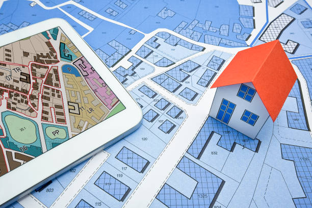 istock Buildings Permit concept with imaginary cadastral on digital tablet - building activity and construction industry concept with General Urban Plan and home model 2148670981