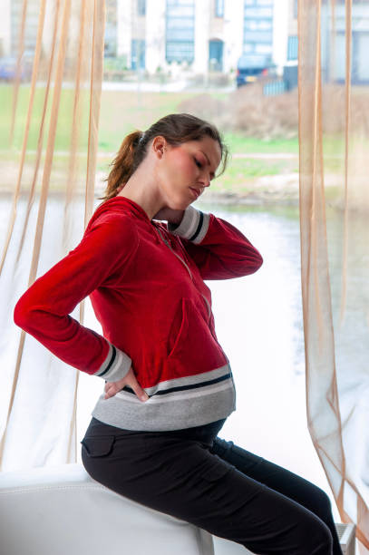 istock Young pregnant woman suffering from backache. 2148671181