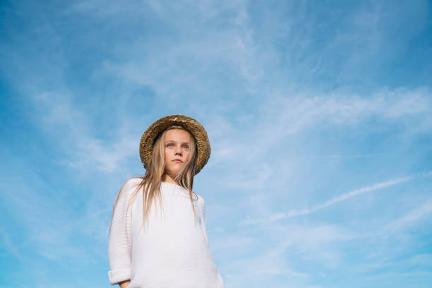 Stylish girl looking at camera with hat