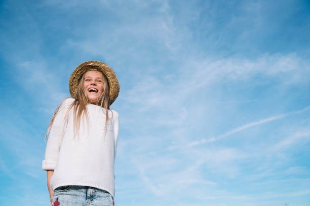 Stylish girl looking at camera with hat