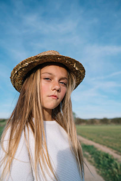 istock Stylish girl looking at camera with hat 2148671896