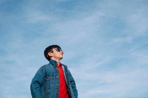 istock Happy kid with sunglasses in the field 2148671925