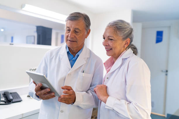 istock Senior Healthcare Professionals Reviewing Data on Tablet 2148672216