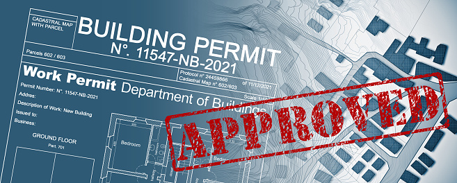 Approved Buildings Permit concept in buildings activity with approved residential building project and imaginary cadastral map.