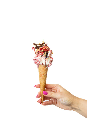 Black cherry Ice cream cone with female hand on white background