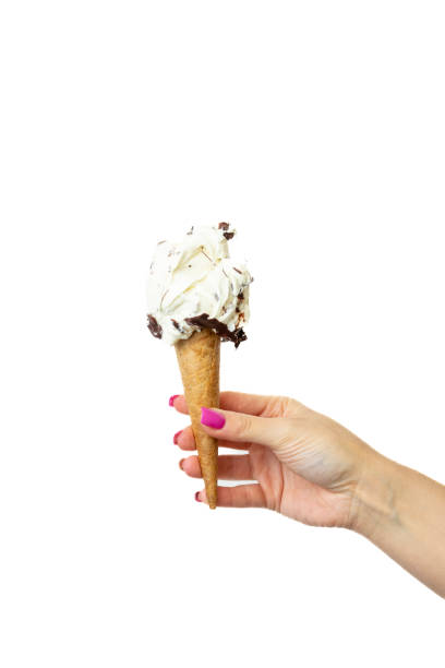 istock Stracciatella Ice cream cone with female hand on white background 2148672304