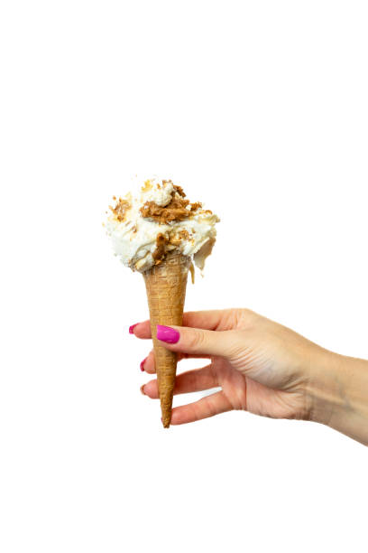 Cookie Ice cream cone with female hand on white background