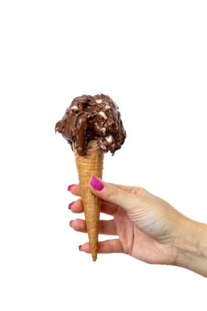 istock Chocolate Ice cream cone with female hand on white background 2148672326