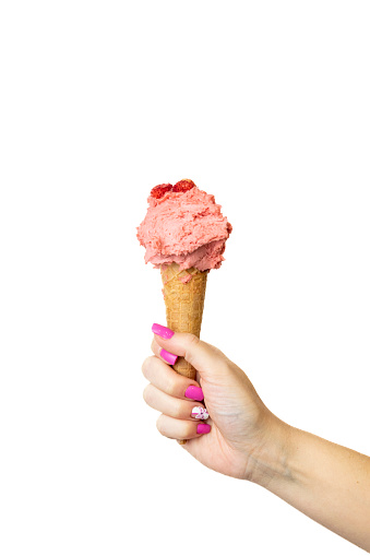 Strawberry Ice cream cone with female hand on white background