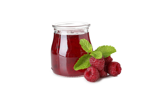 Jar of raspberry jam isolated on white background