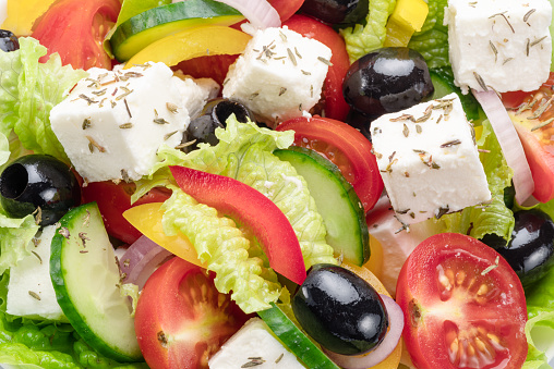 Greek salad  close up. Healthy food background.