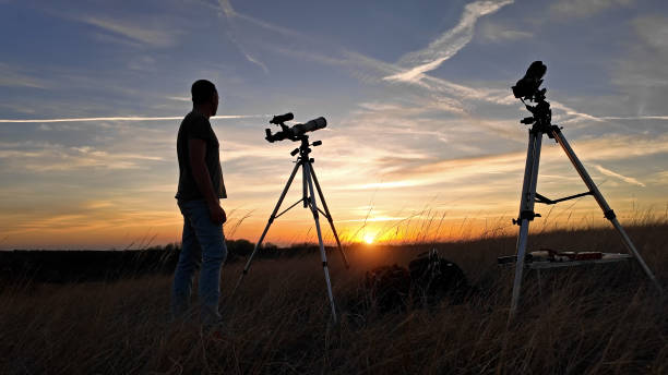 istock Amateur astronomer observing Solar eclipse and Sun with a telescope and special solar filter. 2148674014