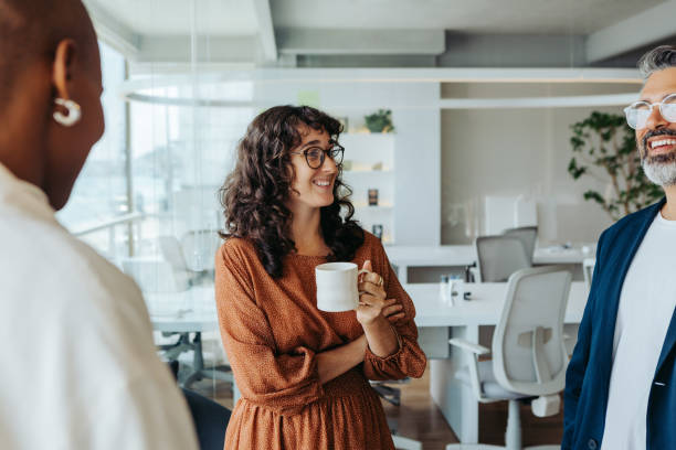 istock Modern office with business professionals having a creative brainstorming session over coffee 2148674037