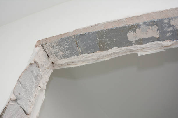istock Close up on house doorway frame repair with plastering 2148674382