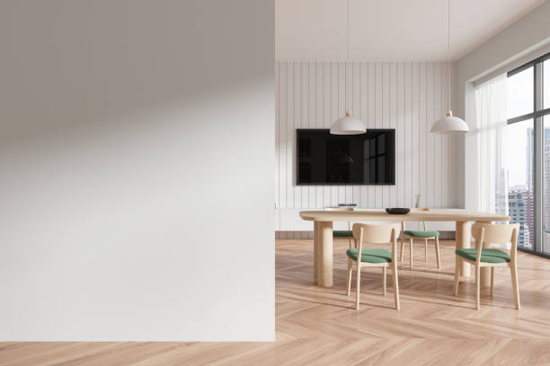 istock White dining room interior with TV and blank wall 2148674681