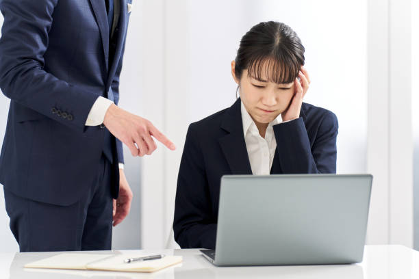Business woman being blamed for problems at work