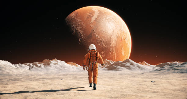 istock Male Astronaut In Space Suit Walking On Alien Planet. Planet Mars Is Visible. 2148677527