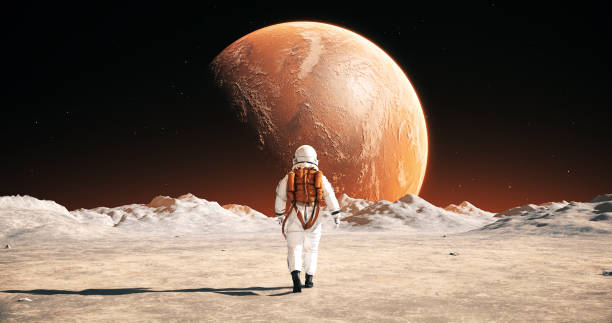 istock Astronaut On An Alien Planet Walking To His Base. Mars Is Visible. 2148677531