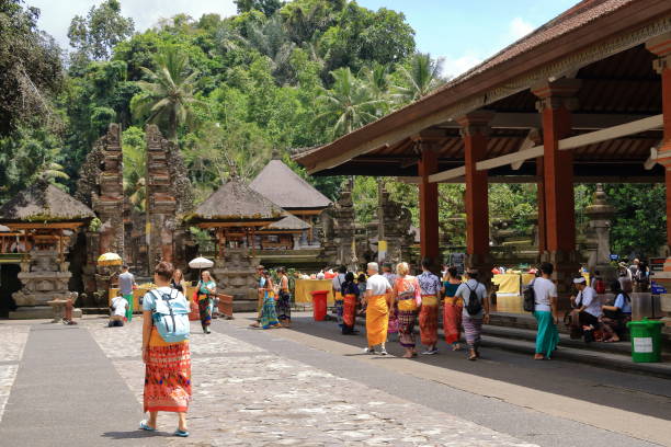 Tampak Siring, Tampaksiring, Bali in Indonesia - January 31 2024: people visit the Tirta Empul temple (Holy Spring Water Temple)