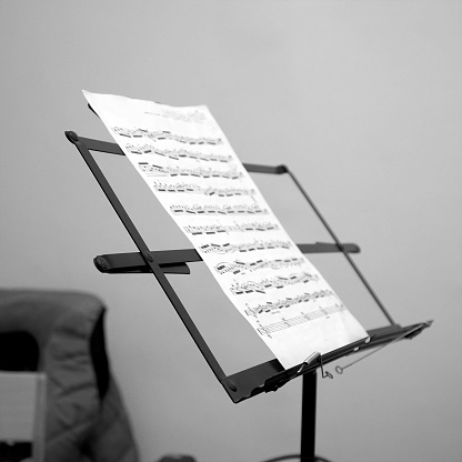 Sheet music on the music stand in room