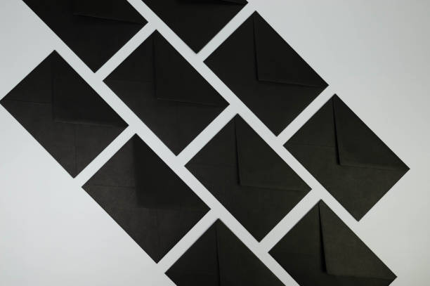 istock Top view of black envelopes on grey background. 2148678818
