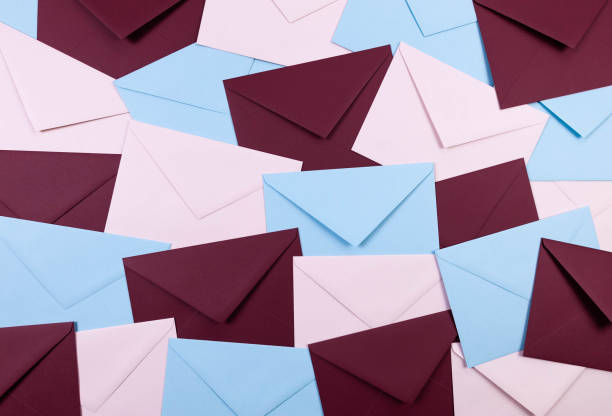 istock Top view of colourful envelopes. Pink, blue and dark red envelopes flat lay. 2148678883