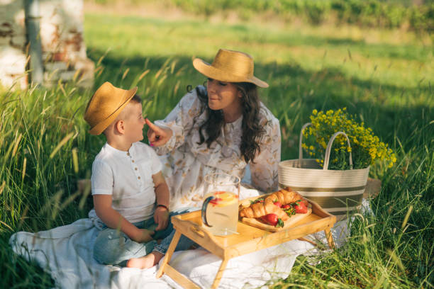 istock Mother and son on a picnic in a beautiful spring time. 2148679017