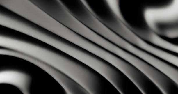 istock Close-up examination of the undulating patterns within black matte plastic 2148679464