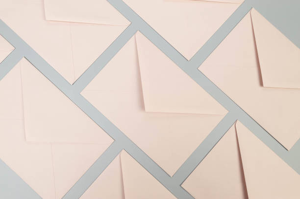 istock Top view of pink envelopes on grey background. 2148679568