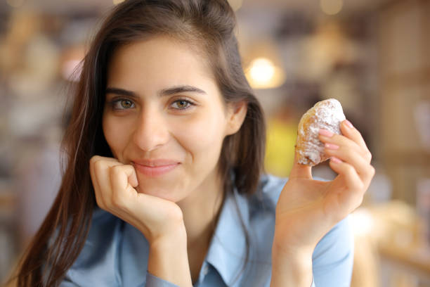 istock Satisfied restaurant customer holding bakery looking at you 2148679649