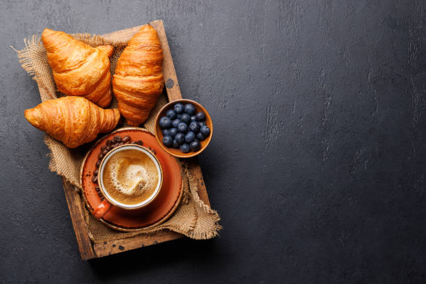 istock Cappuccino coffee and fresh croissants 2148679950