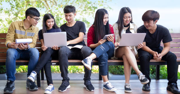 istock Group of Asian students are using laptops to use social media and search for information on the network 2148679984