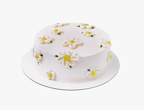 Exquisite and elegant white daisy cake with handmade fondant sugar flowers. Perfect for a birthday or wedding celebration. A delightful gourmet pastry masterpiece on a white background