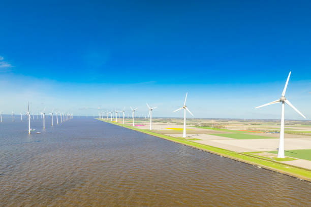 istock Wind turbines in lakeshore wind park producing electricity during 2148683068