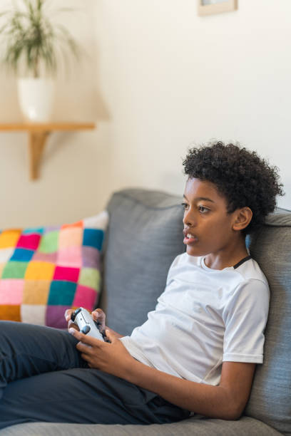 istock Teenager playing a video game 2148683934
