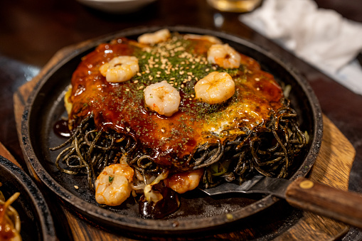 Squid ink seafood Okonomiyaki