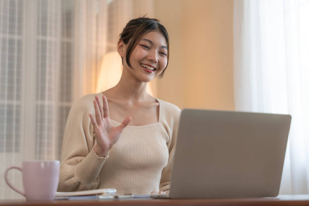 istock Asian Woman in an Engaging Online Conversation. 2148684644