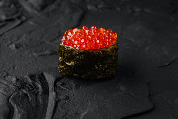 istock Exquisite salmon roe sushi on dark slate 2148684816
