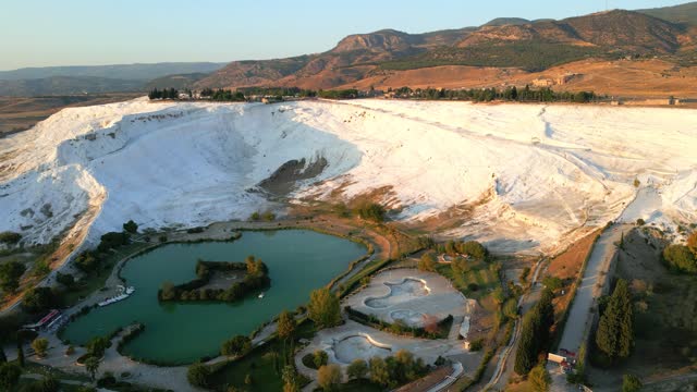 Pamukkale Travertines Cinematic Aerial Drone footage. Turkish famous white thermal bath with healthy clean water .