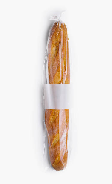 istock Fresh baguette in plastic wrap isolated on white 2148688668